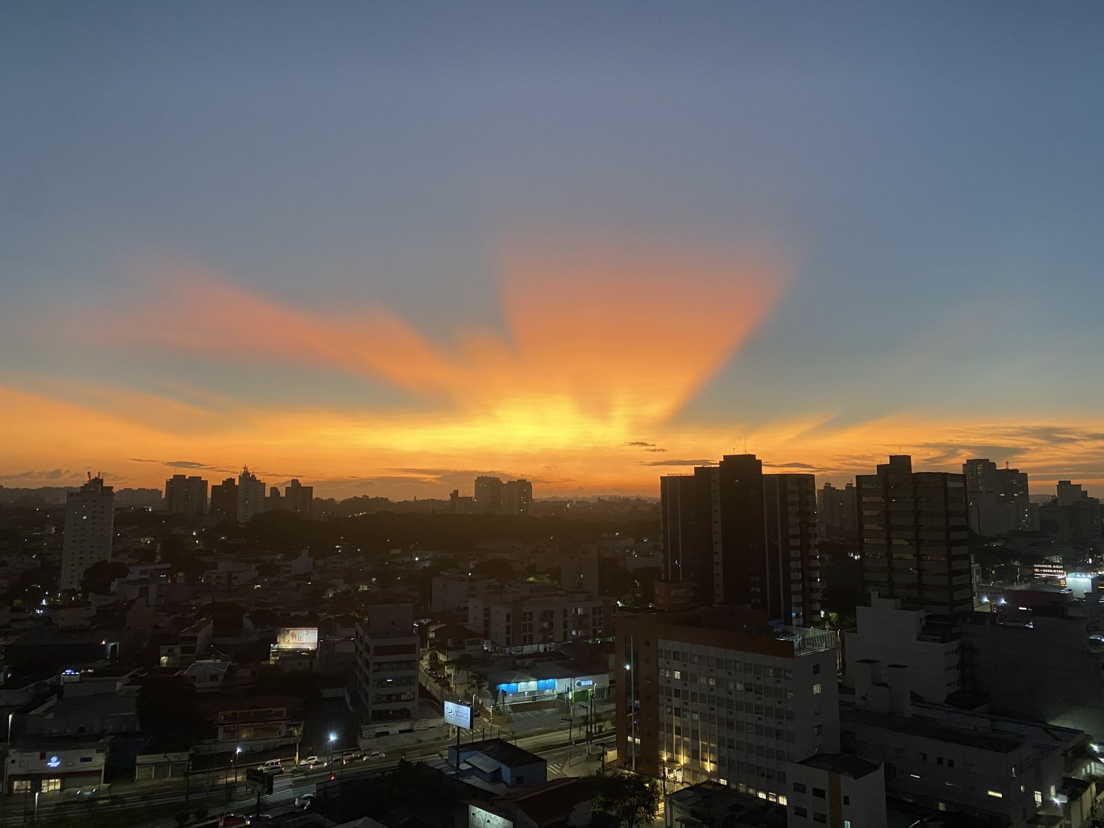Sunset blazes over the city skyline