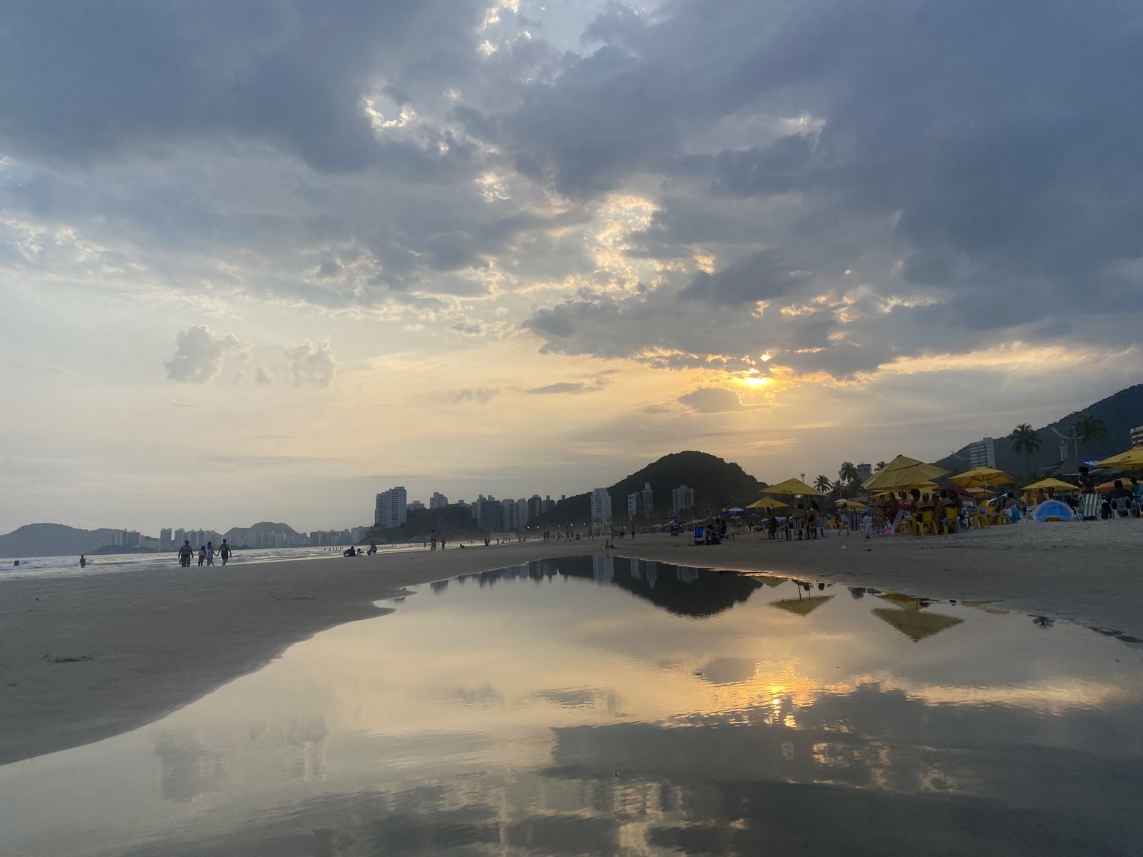 The evening sky reflected in the wet sand