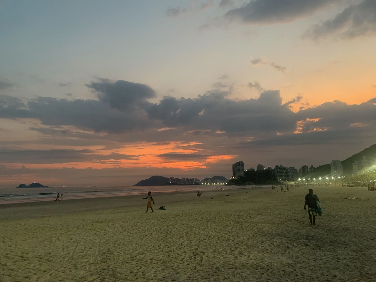 Dusk on the beach, the promenade lights coming on