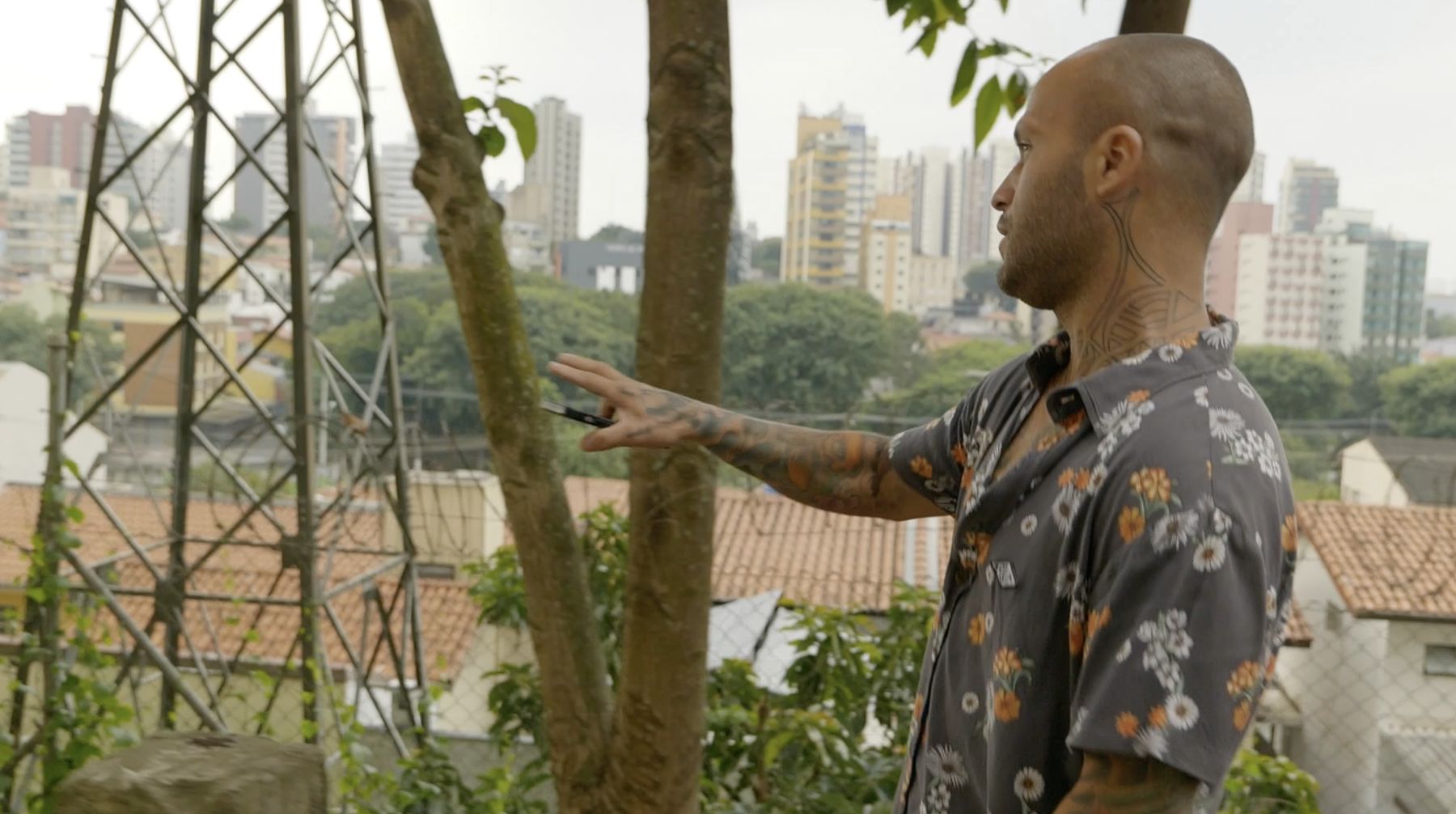 Marcelo points out over the neighbourhood where he grew up