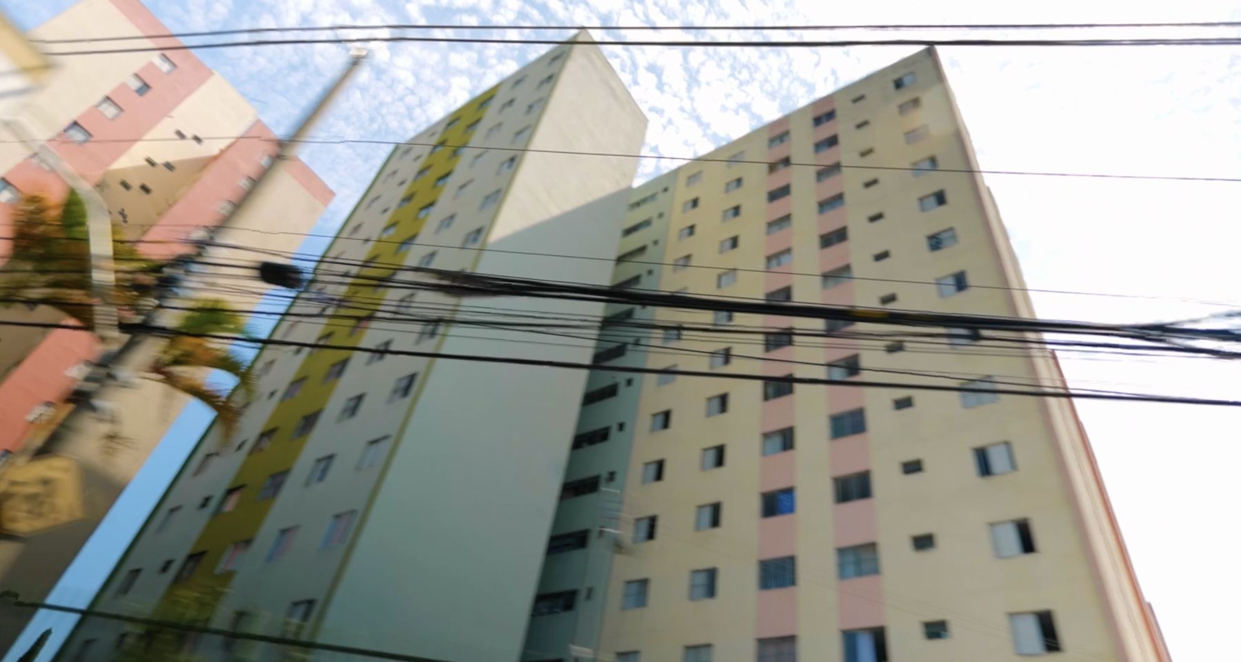 Tower blocks seen through a tangle of power lines
