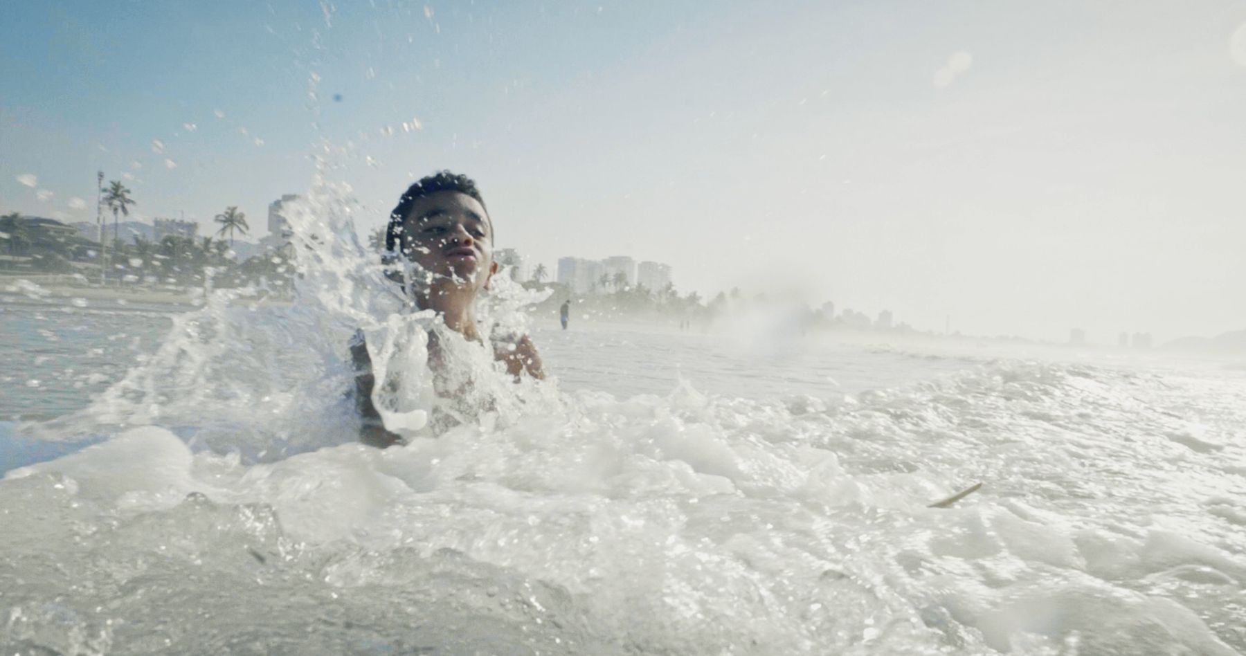 A boy is swallowed by whitewater