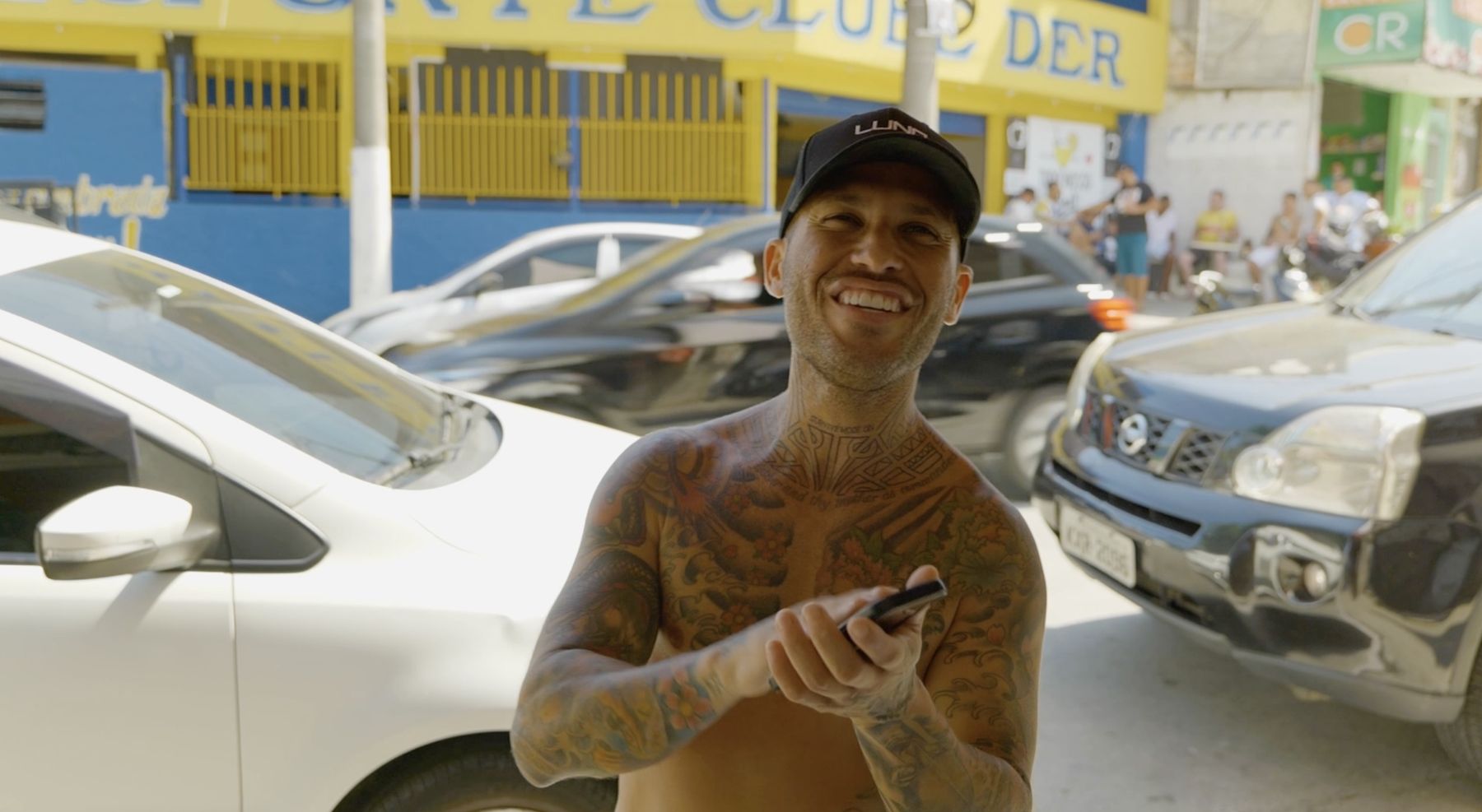 Marcelo grins on a busy street