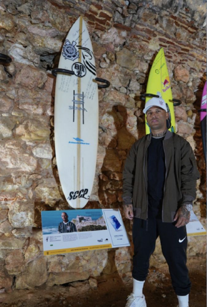 Marcelo beside his board on exhibition