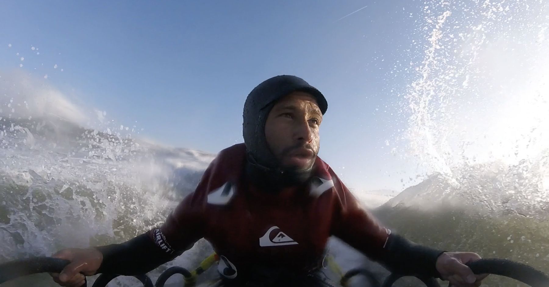 Point-of-view: Marcelo braced on the sled through flying spray